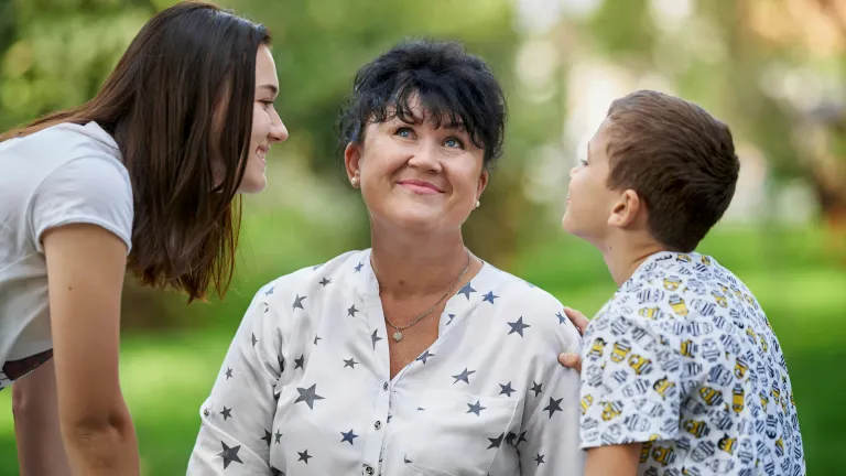 A mom with her daughter and son.