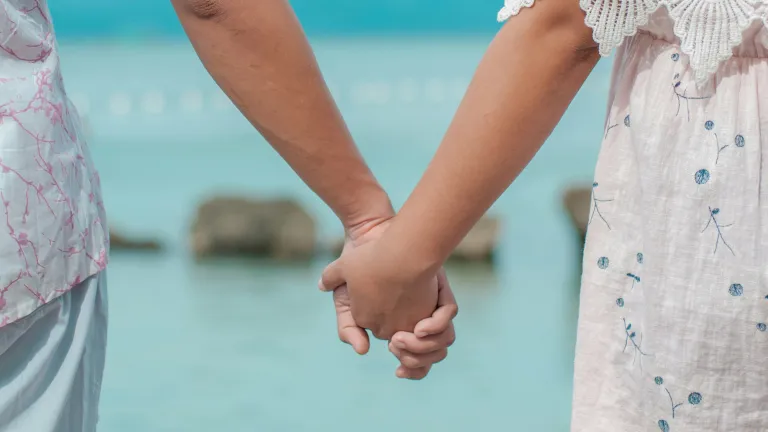 It takes wisdom to be able to acknowledge an attraction to another person while at the same time keeping that attraction in check. a man and a woman holding hands
