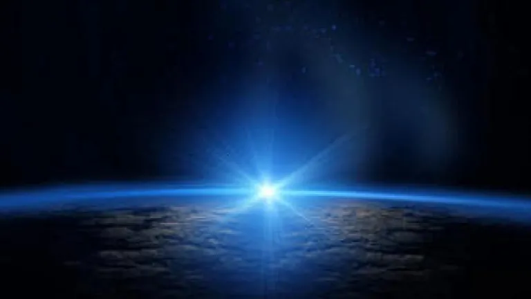 sunlight showing over the horizon of the earth's curve
