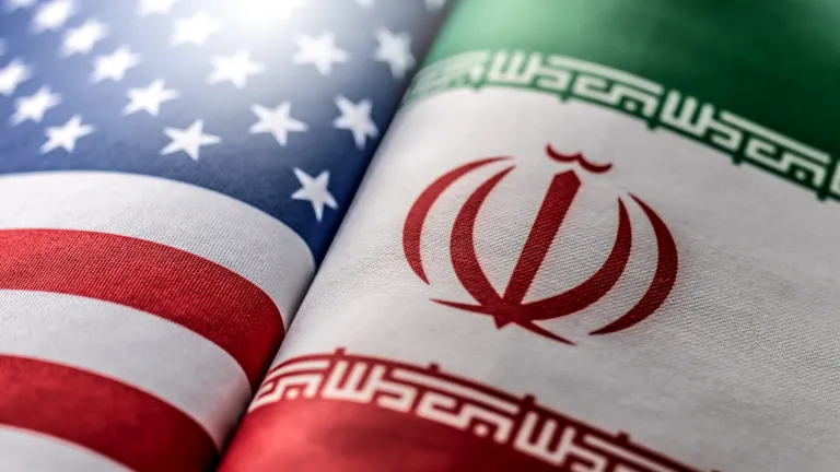 United States and Iranian flags.