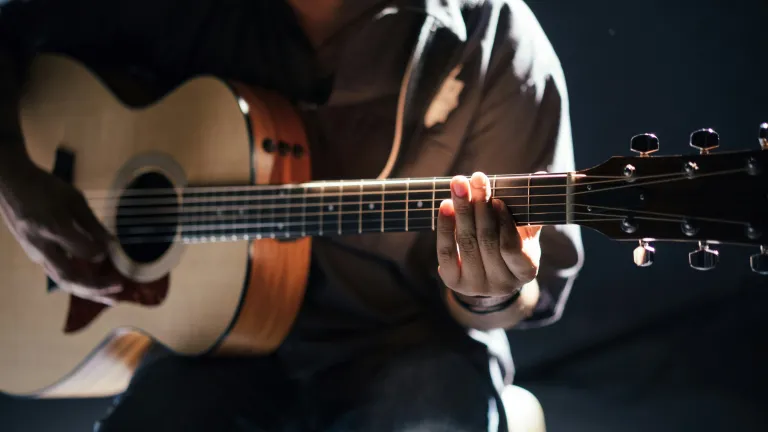 Music is an important means of expression used in the Bible. a man playing a guitar
