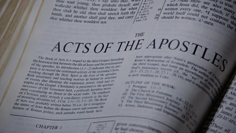 Bible opened to the book of Acts.