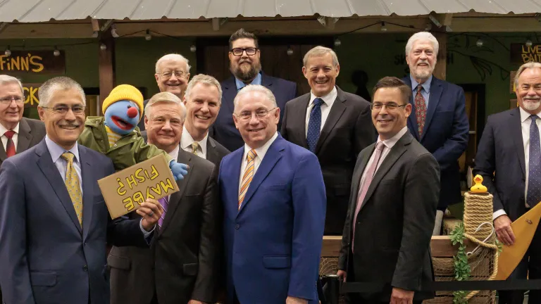 UCG Council of Elders posing with Jelly on set