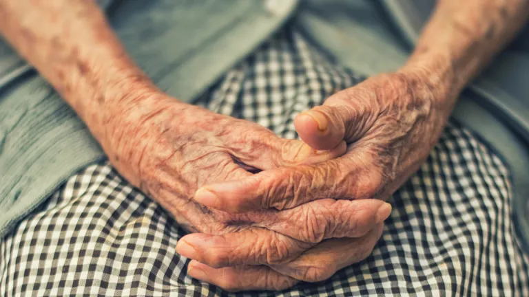 a woman's folded hands