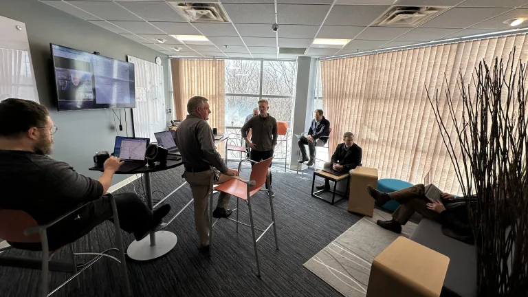 a group of men seated in a conference room