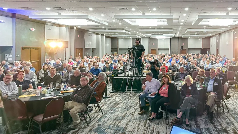 a large group of people sitting indoors