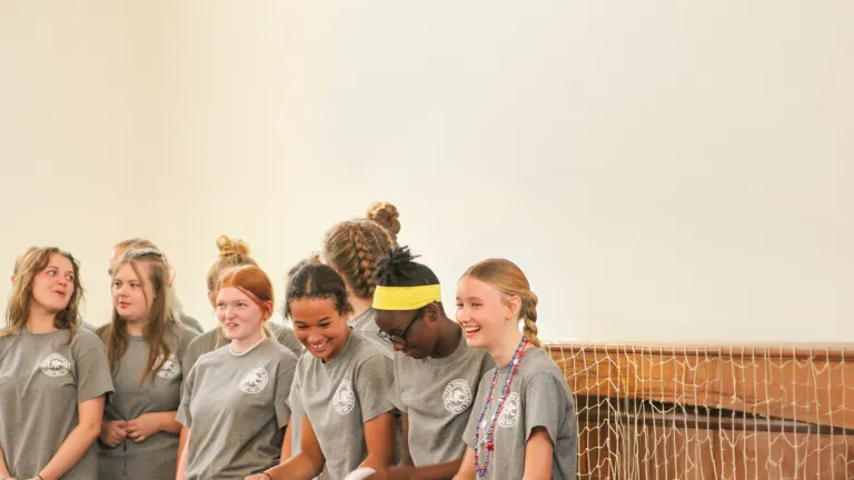 Campers laughing and playing a game