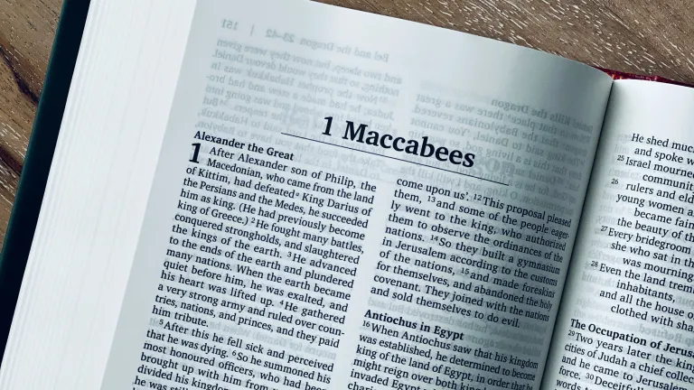 Bible open on a table to 1 Maccabees