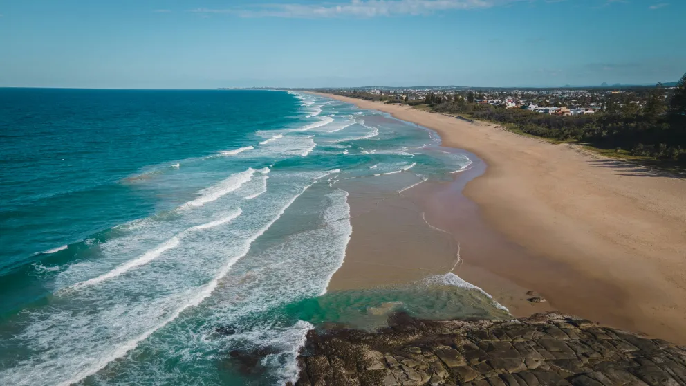 ocean waves on a sandy beach