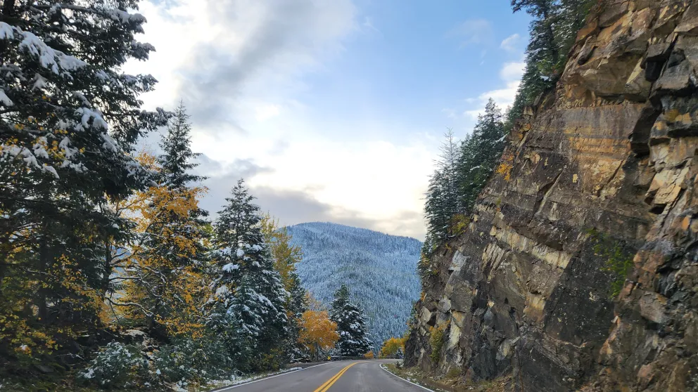 a road with mountains on the horizon