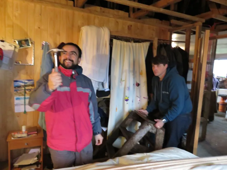 two people with construction tools