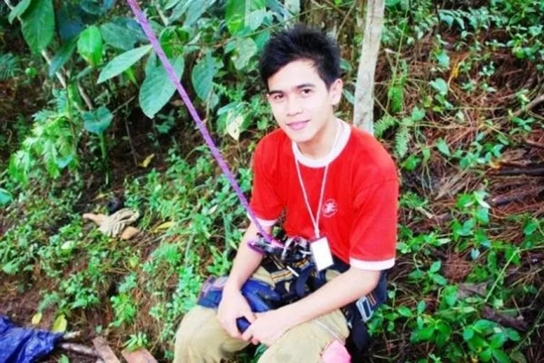 Young man in the Philippines in a climbing harness