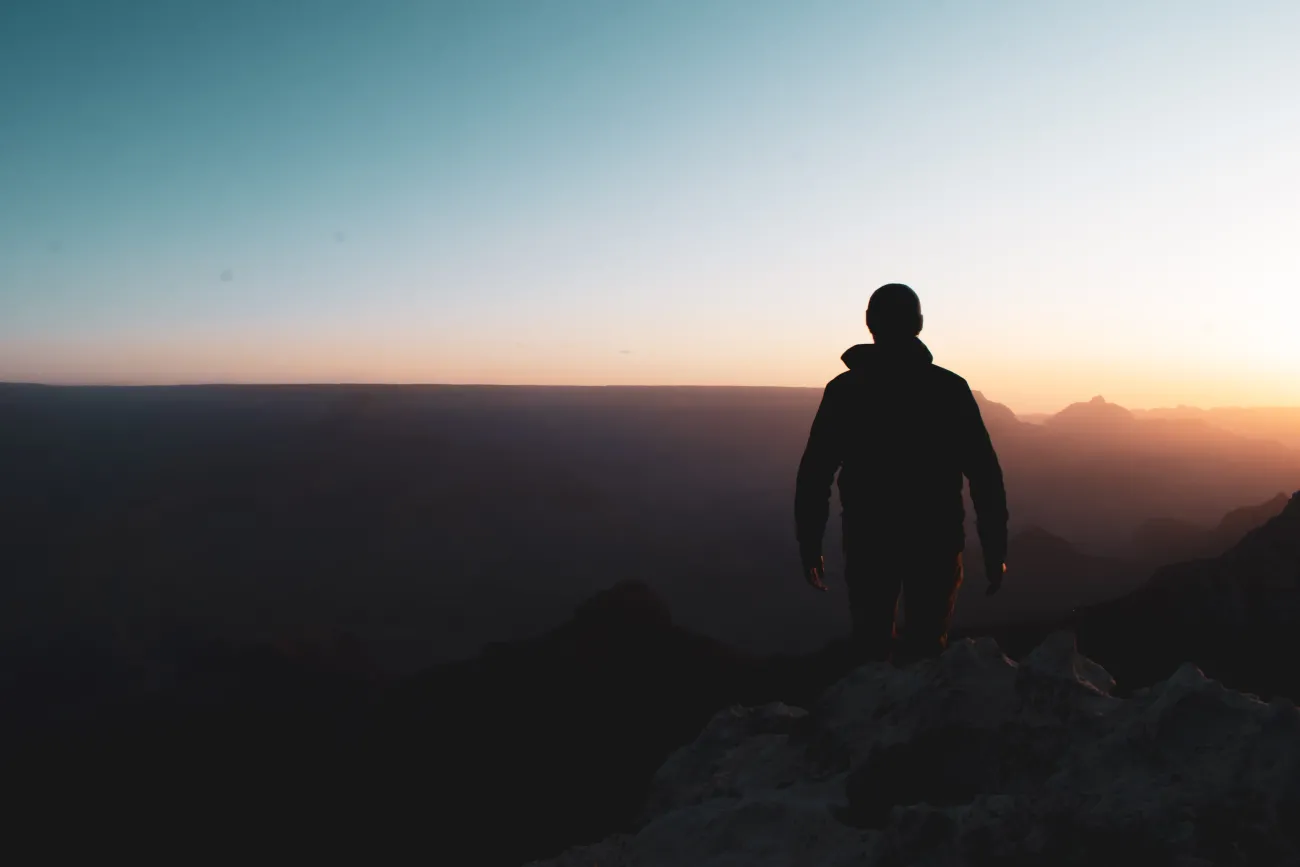 A man looking out over a vista.