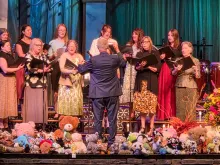 a choir performing on a stage