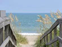 a bridge leading down to the beach