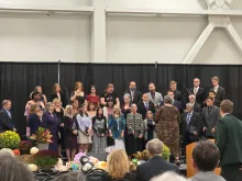 a choir singing on stage
