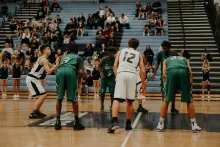 A basketball game in process - shooter at the free throw line.