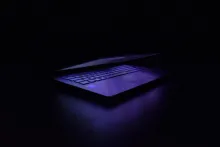 A laptop in the dark.