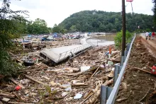 The Rocky Broad River flows into Lake Lure and overflows the town with debris from Chimney Rock, North Carolina after heavy rains from Hurricane Helene on Sept. 28, 2024.