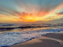 a beach at sunset
