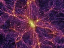 Crackles of orange streak across a purple background, representing tendrils of dispersed material in the cosmic web that unites all galaxies.