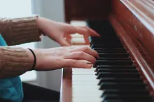 Playing piano.