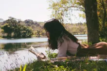 A woman reading a book.