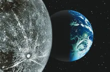 A photo of the Earth and moon from space.