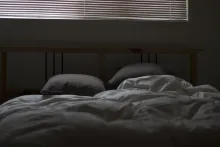 An bed that has been slept in.
