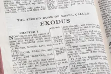 A Bible opened to the book of Exodus.