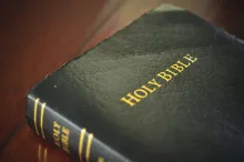 A Bible laying on a table.