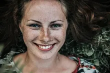 Upclose photo of a young woman face.