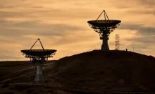 Satellite dishes pointing up into the sky.