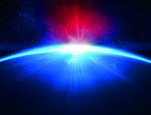 Sun coming over the horizon the earth.