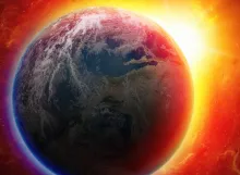 The earth from space with a red/orange glow in the background.