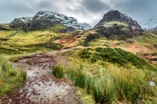 A stony path leading up to mountains.