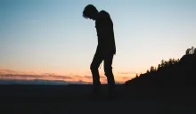 A silhouette of young man.