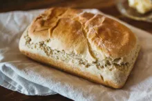 A loaf of bread on a cloth napkin.