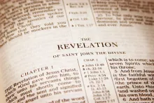 A Bible opened to the book of Revelation.