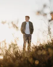 A man walking in a field.