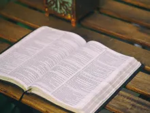 A Bible laying on a table.