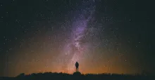 A person staring up at the night sky.