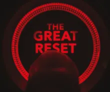 A finger pushing a "reset" button.