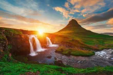 A gorgeous landscape photo of Kirkjufell in Iceland at sunset.