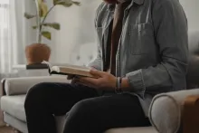 A man looking at a Bible.