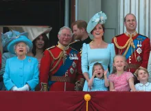 Four generations of Britain’s royal family watch a military flyover at Buckingham Palace.