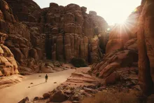 A man walking in the desert.