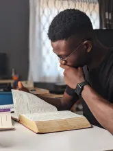 a man reading a Bible