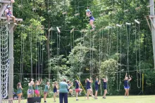 campers using a high ropes course outside