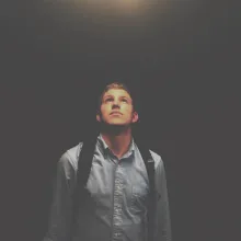A young man looking up.